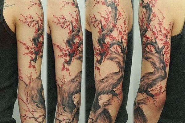 Arm cherry blossom tattoo